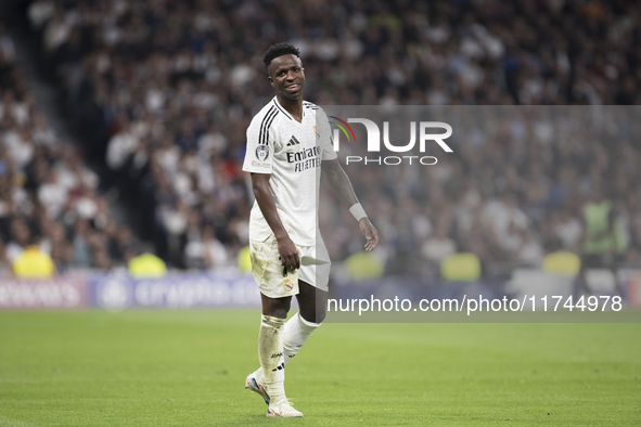 Vinicius Jr of Real Madrid reacts to a missed opportunity during the UEFA Champions League 2024/25 match between Real Madrid and AC Milan at...