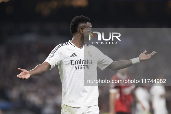 Vinicius Jr of Real Madrid reacts to a missed opportunity during the UEFA Champions League 2024/25 match between Real Madrid and AC Milan at...