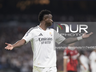 Vinicius Jr of Real Madrid reacts to a missed opportunity during the UEFA Champions League 2024/25 match between Real Madrid and AC Milan at...