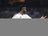 Vinicius Jr of Real Madrid reacts to a missed opportunity during the UEFA Champions League 2024/25 match between Real Madrid and AC Milan at...