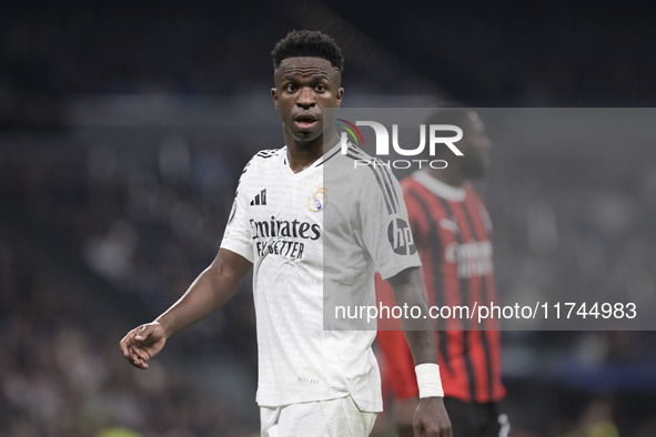 Vinicius Jr of Real Madrid plays during the UEFA Champions League 2024/25 match between Real Madrid and AC Milan at Santiago Bernabeu Stadiu...