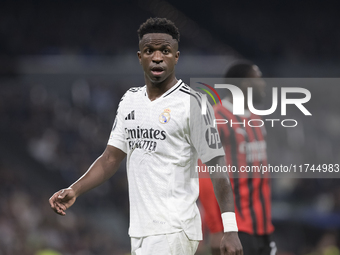 Vinicius Jr of Real Madrid plays during the UEFA Champions League 2024/25 match between Real Madrid and AC Milan at Santiago Bernabeu Stadiu...