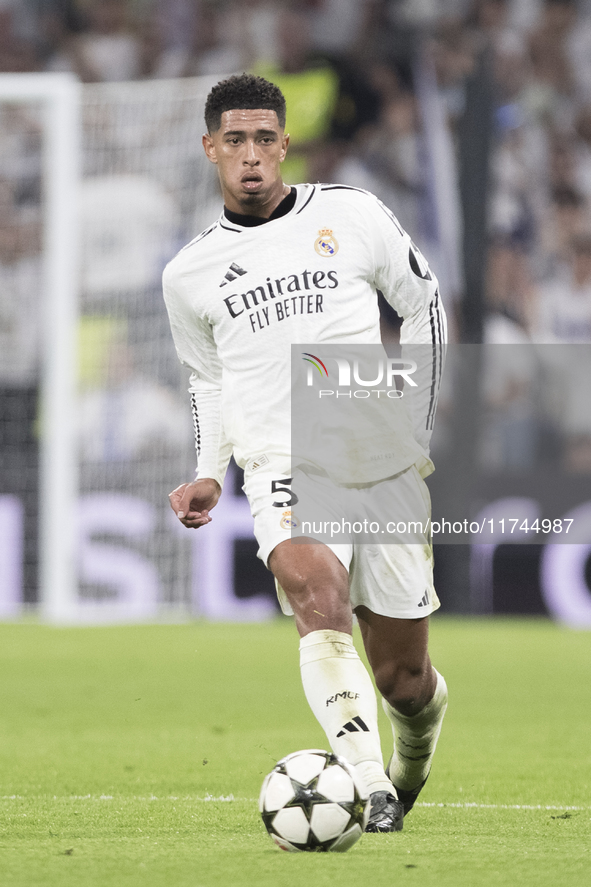 Jude Bellingham of Real Madrid is in action during the UEFA Champions League 2024/25 match between Real Madrid and AC Milan at Santiago Bern...