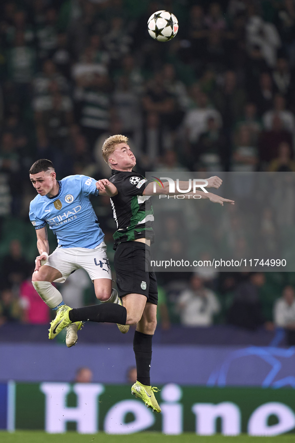 Phil Foden of Manchester City competes for the ball with Conrad Harder of Sporting CP during the UEFA Champions League match between Sportin...