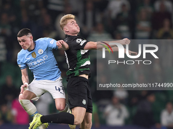 Phil Foden of Manchester City competes for the ball with Conrad Harder of Sporting CP during the UEFA Champions League match between Sportin...