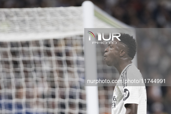 Vinicius Jr of Real Madrid reacts to a missed opportunity during the UEFA Champions League 2024/25 match between Real Madrid and AC Milan at...