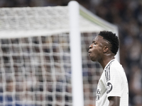 Vinicius Jr of Real Madrid reacts to a missed opportunity during the UEFA Champions League 2024/25 match between Real Madrid and AC Milan at...