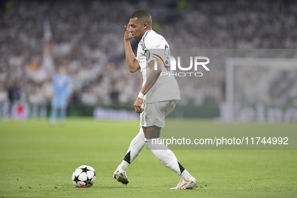 Kylian Mbappe of Real Madrid controls the ball during the UEFA Champions League 2024/25 match between Real Madrid and AC Milan at Santiago B...