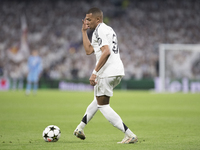 Kylian Mbappe of Real Madrid controls the ball during the UEFA Champions League 2024/25 match between Real Madrid and AC Milan at Santiago B...