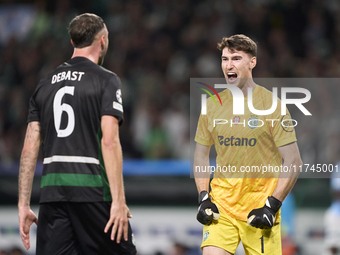 Franco Israel of Sporting CP celebrates victory with Zeno Debast after the UEFA Champions League match between Sporting CP and Manchester Ci...