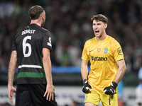 Franco Israel of Sporting CP celebrates victory with Zeno Debast after the UEFA Champions League match between Sporting CP and Manchester Ci...