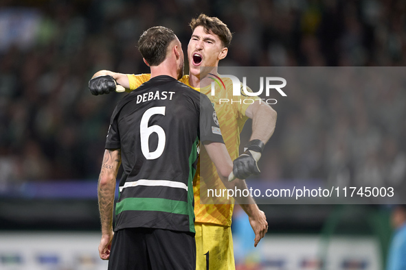 Franco Israel of Sporting CP celebrates victory with Zeno Debast after the UEFA Champions League match between Sporting CP and Manchester Ci...