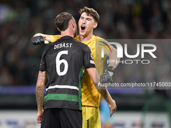 Franco Israel of Sporting CP celebrates victory with Zeno Debast after the UEFA Champions League match between Sporting CP and Manchester Ci...