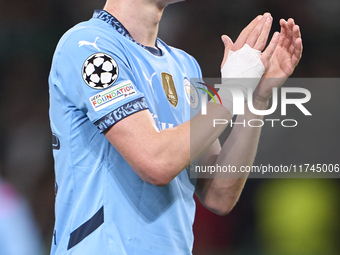 Phil Foden of Manchester City shows appreciation to the fans after the UEFA Champions League match between Sporting CP and Manchester City a...