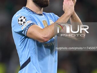 Josko Gvardiol of Manchester City shows appreciation to the fans after the UEFA Champions League match between Sporting CP and Manchester Ci...