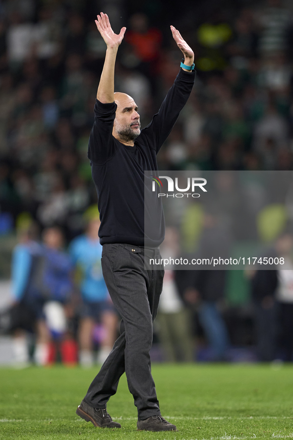 Pep Guardiola, Head Coach of Manchester City, shows appreciation to the fans after the UEFA Champions League match between Sporting CP and M...