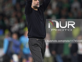 Pep Guardiola, Head Coach of Manchester City, shows appreciation to the fans after the UEFA Champions League match between Sporting CP and M...