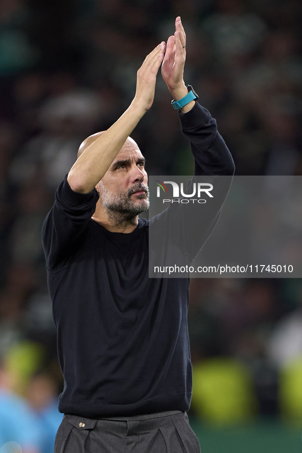 Pep Guardiola, Head Coach of Manchester City, shows appreciation to the fans after the UEFA Champions League match between Sporting CP and M...