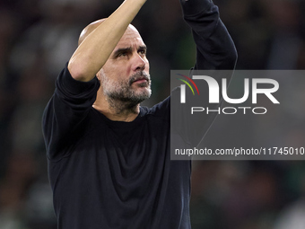 Pep Guardiola, Head Coach of Manchester City, shows appreciation to the fans after the UEFA Champions League match between Sporting CP and M...