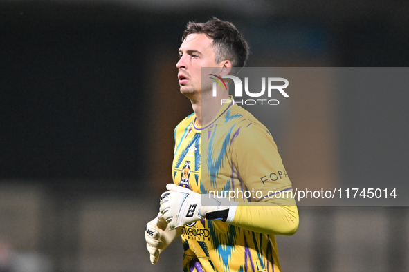 Goalkeeper Jack Stevens of Cambridge United plays during the EFL Trophy match between Cambridge United and Chelsea Under 21s at the Cledara...