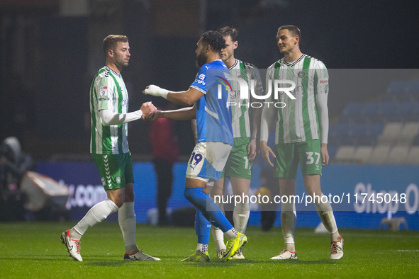 Players shake hands at full time during the Sky Bet League 1 match between Stockport County and Wycombe Wanderers at the Edgeley Park Stadiu...