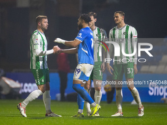 Players shake hands at full time during the Sky Bet League 1 match between Stockport County and Wycombe Wanderers at the Edgeley Park Stadiu...