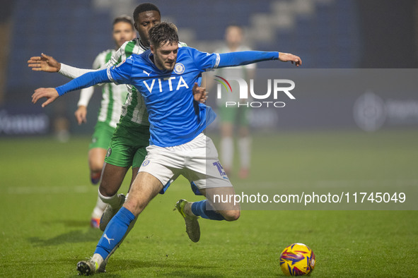 Ethan Pye #15 of Stockport County F.C. is tackled by Beryly Lubala #30 of Wycombe Wanderers F.C. during the Sky Bet League 1 match between S...