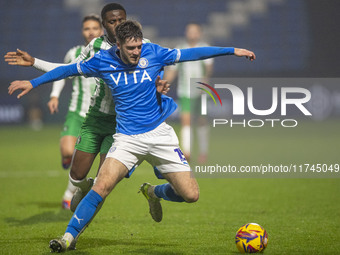 Ethan Pye #15 of Stockport County F.C. is tackled by Beryly Lubala #30 of Wycombe Wanderers F.C. during the Sky Bet League 1 match between S...