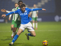 Ethan Pye #15 of Stockport County F.C. is tackled by Beryly Lubala #30 of Wycombe Wanderers F.C. during the Sky Bet League 1 match between S...