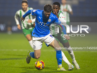 Ethan Pye #15 of Stockport County F.C. is tackled by Beryly Lubala #30 of Wycombe Wanderers F.C. during the Sky Bet League 1 match between S...