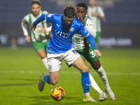 Ethan Pye #15 of Stockport County F.C. is tackled by Beryly Lubala #30 of Wycombe Wanderers F.C. during the Sky Bet League 1 match between S...