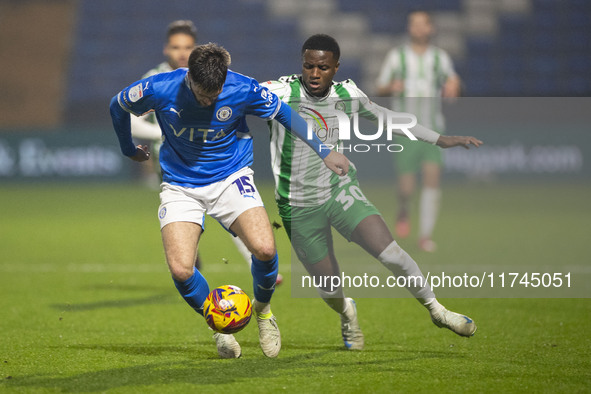 Ethan Pye #15 of Stockport County F.C. is tackled by Beryly Lubala #30 of Wycombe Wanderers F.C. during the Sky Bet League 1 match between S...