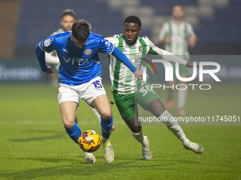 Ethan Pye #15 of Stockport County F.C. is tackled by Beryly Lubala #30 of Wycombe Wanderers F.C. during the Sky Bet League 1 match between S...