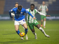 Ethan Pye #15 of Stockport County F.C. is tackled by Beryly Lubala #30 of Wycombe Wanderers F.C. during the Sky Bet League 1 match between S...