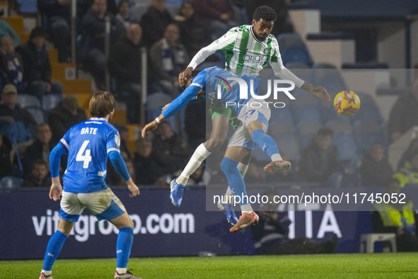 Odin Bailey #27 of Stockport County F.C. engages in an aerial challenge with an opponent during the Sky Bet League 1 match between Stockport...