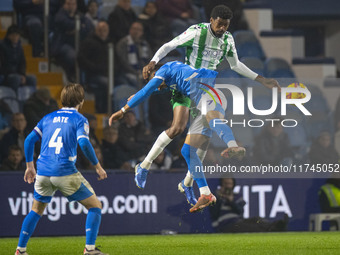 Odin Bailey #27 of Stockport County F.C. engages in an aerial challenge with an opponent during the Sky Bet League 1 match between Stockport...