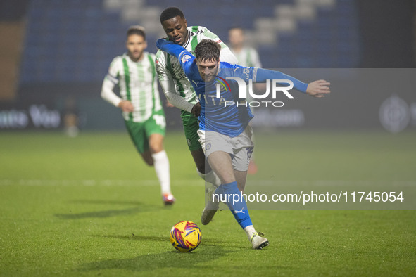 Ethan Pye #15 of Stockport County F.C. is tackled by Beryly Lubala #30 of Wycombe Wanderers F.C. during the Sky Bet League 1 match between S...