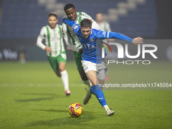 Ethan Pye #15 of Stockport County F.C. is tackled by Beryly Lubala #30 of Wycombe Wanderers F.C. during the Sky Bet League 1 match between S...