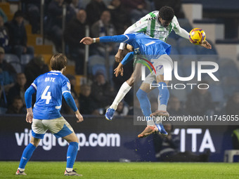 Odin Bailey #27 of Stockport County F.C. engages in an aerial challenge with an opponent during the Sky Bet League 1 match between Stockport...