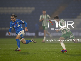 Lewis Bate #4 of Stockport County F.C. is challenged by Cameron Humphreys #20 of Wycombe Wanderers F.C. during the Sky Bet League 1 match be...