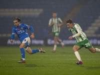 Lewis Bate #4 of Stockport County F.C. is challenged by Cameron Humphreys #20 of Wycombe Wanderers F.C. during the Sky Bet League 1 match be...