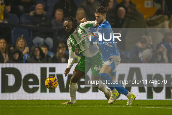 Fred Onyedinma #44 of Wycombe Wanderers F.C. is challenged by an opponent during the Sky Bet League 1 match between Stockport County and Wyc...