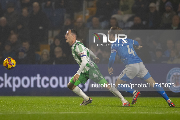 Josh Scowen #4 of Wycombe Wanderers F.C. is challenged by Lewis Bate #4 of Stockport County F.C. during the Sky Bet League 1 match between S...