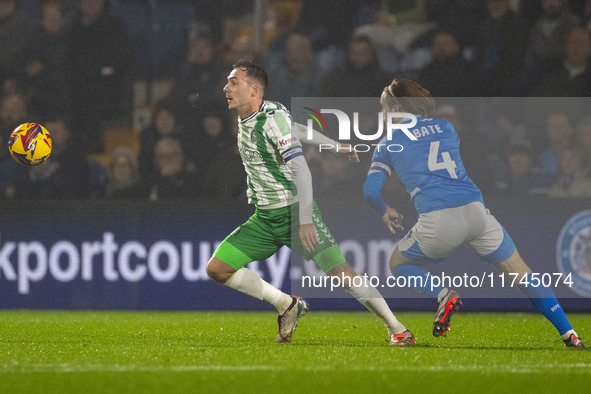 Josh Scowen #4 of Wycombe Wanderers F.C. is challenged by Lewis Bate #4 of Stockport County F.C. during the Sky Bet League 1 match between S...