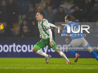 Josh Scowen #4 of Wycombe Wanderers F.C. is challenged by Lewis Bate #4 of Stockport County F.C. during the Sky Bet League 1 match between S...