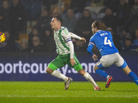 Josh Scowen #4 of Wycombe Wanderers F.C. is challenged by Lewis Bate #4 of Stockport County F.C. during the Sky Bet League 1 match between S...