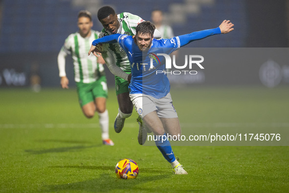 Ethan Pye #15 of Stockport County F.C. is tackled by Beryly Lubala #30 of Wycombe Wanderers F.C. during the Sky Bet League 1 match between S...