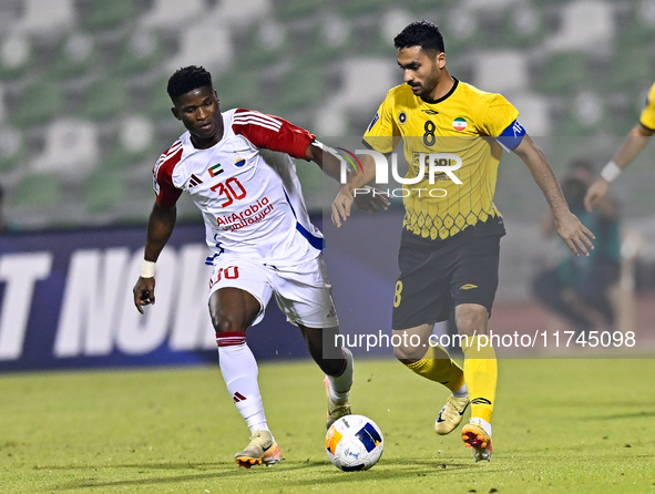 Seyed Mohammad Karimi of Asepahan SC battles for the ball with Ousmane Camar of Sharjah FC during the AFC Champions League Two Group A footb...