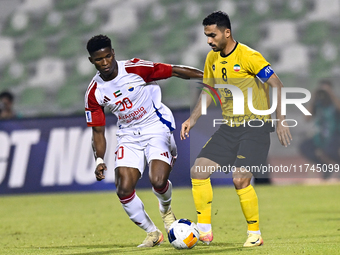 Seyed Mohammad Karimi of Asepahan SC battles for the ball with Ousmane Camar of Sharjah FC during the AFC Champions League Two Group A footb...