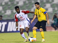 Seyed Mohammad Karimi of Asepahan SC battles for the ball with Ousmane Camar of Sharjah FC during the AFC Champions League Two Group A footb...